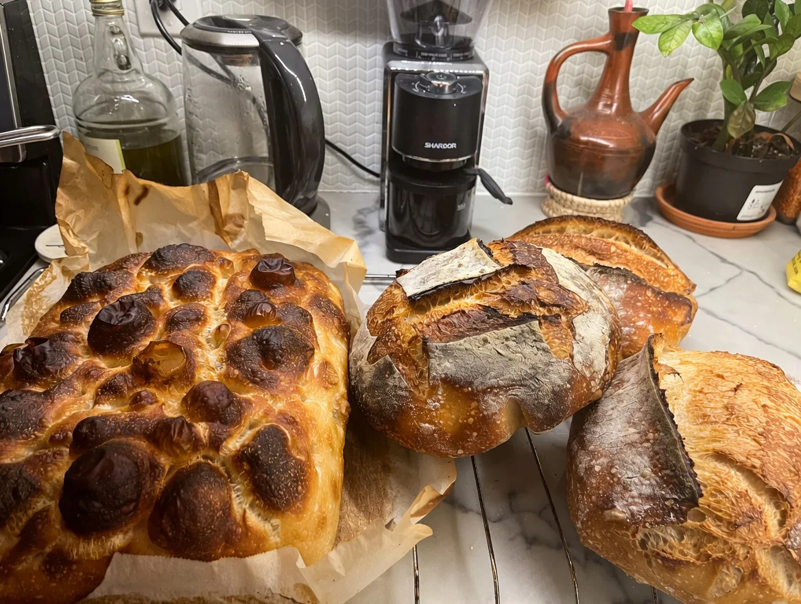 Freshly baked breads and rolls arranged together