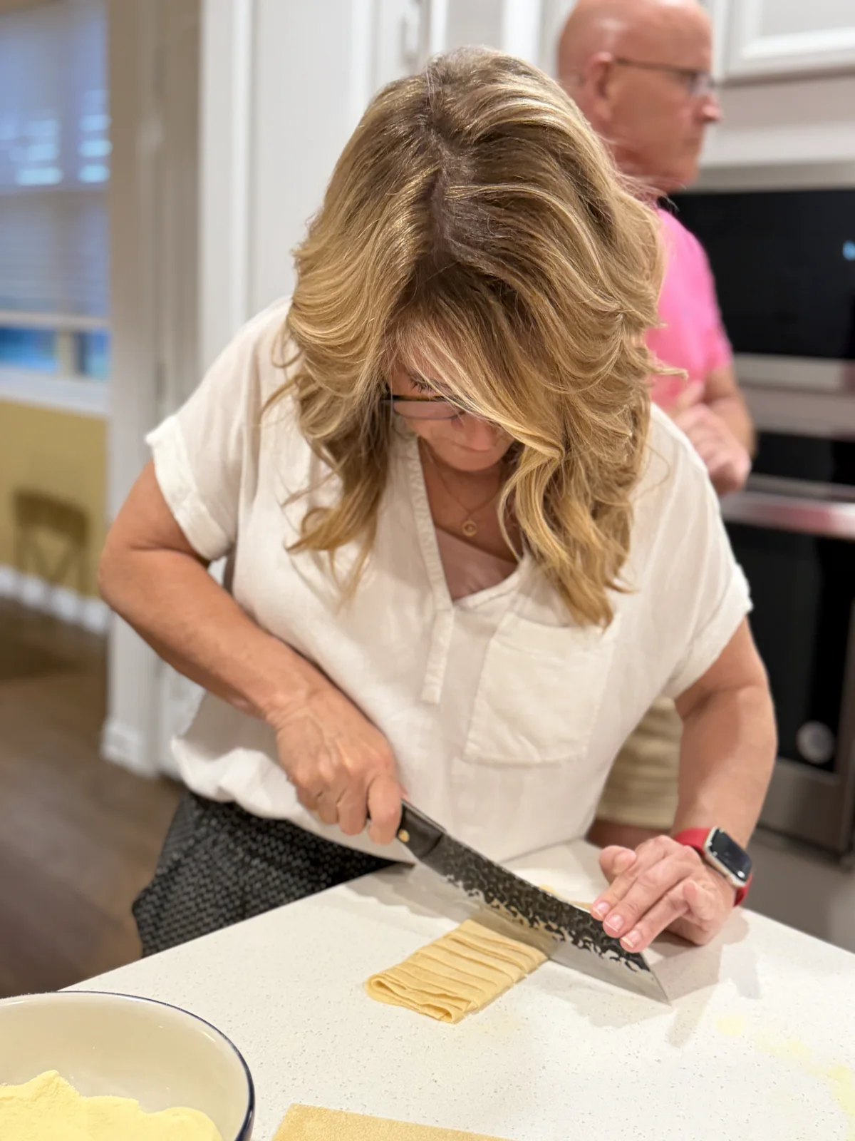 Guest cutting fresh pasta by hand